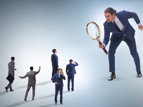 Boss towering over employee